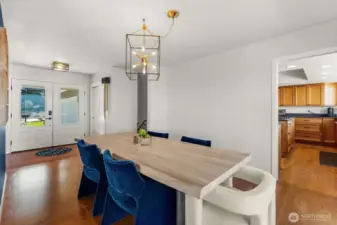 Dining room with entry way to kitchen and down the hall