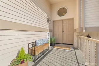 Grand double doors welcome you into a spacious entry porche, ideal for holiday décor and hanging plants, creating a warm, inviting feel