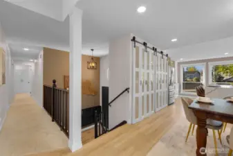 Abundant natural light fills the main floor, enhanced by surrounding windows