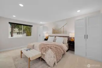 Primary bedroom is spacious and offers additional closet space
