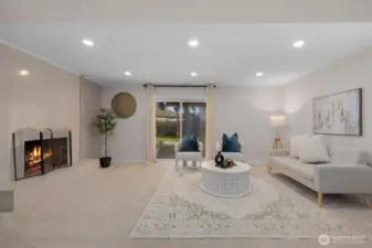 Expansive lower-level family room centered around a charming wood-burning fireplace, creating a warm and inviting retreat