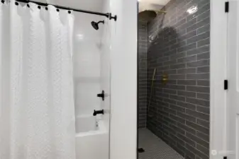 Lower level full bathroom with beautiful custom tile shower.