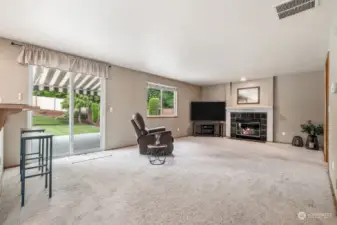 Great Room with gas fireplace and slider to backyard and patio.
