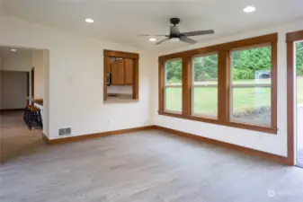 Dining room with pass through to kitchen and doorway to great room/kitchen