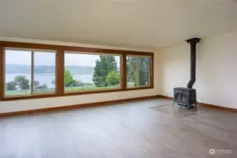 Great room with wood stove and panoramic view of Fisherman Bay