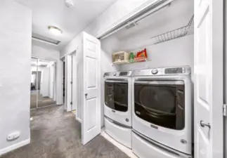 Upper level Laundry Area with washer/dryer set and drawers.