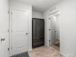 Garage door on the left, extra storage, laundry room on the right