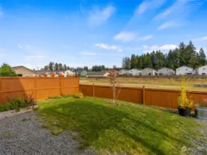 Space to walk the dogs behind the fence & a water reservoir.