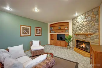 Family with wood burning fireplace..