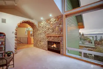 Living room with wood burning fireplace..
