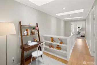 Skylit and serene, this open landing is a dream spot for a tucked-away homework station, craft zone, or peaceful reading nook.