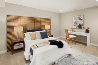 Tucked away for quiet and privacy, the lower-level bedroom is generous in size and big on options — think guest room, gym, or media zone.