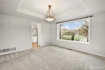 Dining room with view of sports court and back yard
