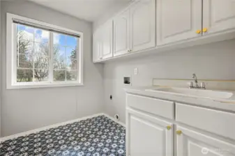 Nice laundry room with new flooring