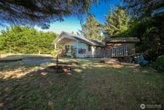 Home, large shed, extra lot and a fire pit for your smores.