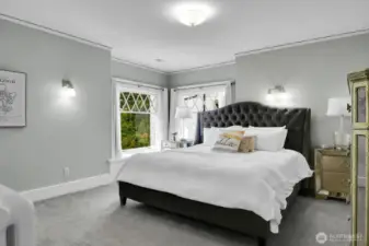 The primary bedroom has its own window seats and direct access to the luxurious full bathroom.