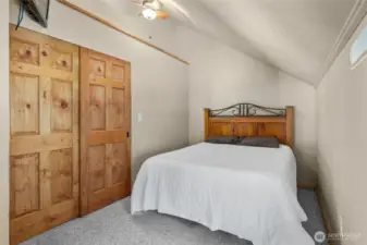 Upstairs- Bedroom #2 also has lovely wood doors on the large closet, & a nice view!