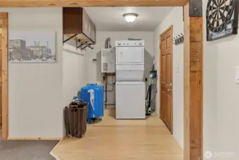 Main floor laundry, mechanical area, with access to the covered back area to bring wood inside during the winter!