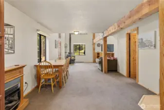Space between living room & kitchen is a flex space for dining, reading nook, or whatever makes you happy! It has a propane fireplace for extra coziness.