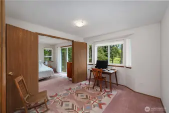 Primary ensuite with french doors that open to this office space.