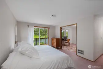 Primary bedroom spacious and open with a lake view!