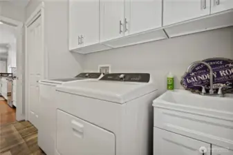 Laundry room with sink washer and dryer are included