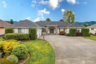 Immaculate front yard landscaping with sprinkler system.