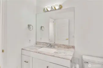 Guest bathroom with new shower door, new toilet and new flooring