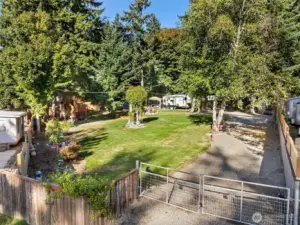 Beautifully landscaped lot backed by a lush forest.