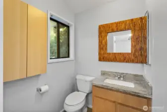 Functional half-bath attached to the upper level bedroom