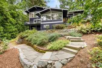 Stone path guiding you through landscaped gardens