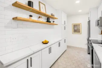 Full kitchen renovation in 2021 features; heater floor, Quartz counters, sleek cabinetry and new stainless steel appliances.