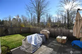 Large patio in fully fenced back yard ~ backing to a wooded greenbelt for extra privacy!