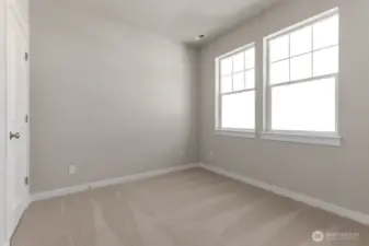 Main floor bedroom/office had a closet and large windows to let in lots of light.  Colors and finishes may vary.