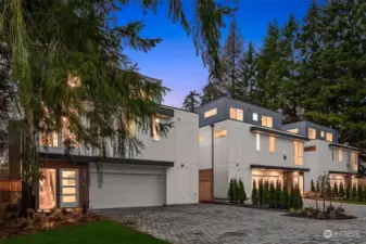 These modern homes stand proud against a backdrop of lush greenery, offering a blend of privacy and sophistication in the heart of Bothell.