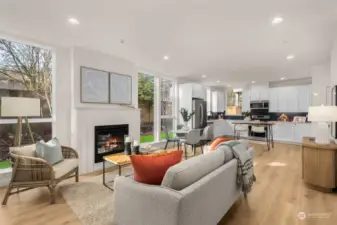 An open floor plan connects the living room, dining area, and kitchen, making this space ideal for entertaining and everyday living. The modern finishes and abundant light elevate every moment spent here.