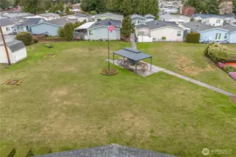BBQ/Picnic Area: Community BBQ and picnic space perfect for outdoor gatherings and enjoying time with neighbors.