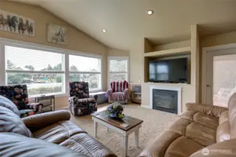 Built in fireplace and door to the covered rear deck.