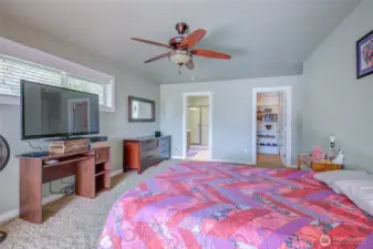 Primary suite also has an en-suite bath and walk in closet.