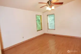 Nice sized primary bedroom overlooking the back yard and woods.