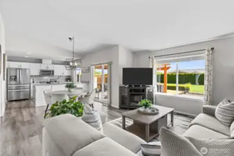 Open floor plan with living room open to dining room and kitchen.