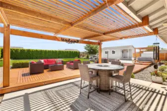 Fully fenced private backyard with patio and deck.