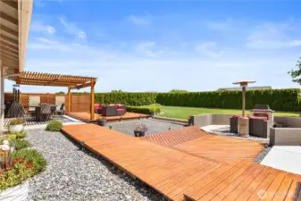 Backyard is great for entertaining with multiple areas to sit and relax.
