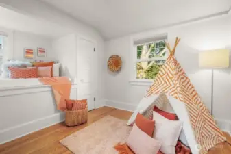 There are four bedrooms upstairs. This is the first room with cute elevated bed-great for kids or a teenager?