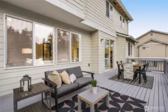 Large deck for BBQs and dining, conveniently next to the kitchen.