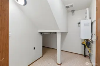 Laundry Room with extra storage + High Efficiency Tankless Water Heater