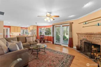 Enjoy easy access from your living room to your backyard retreat! In case it's a bit too chilly outside, come back inside and warm up by your own wood burning fireplace!