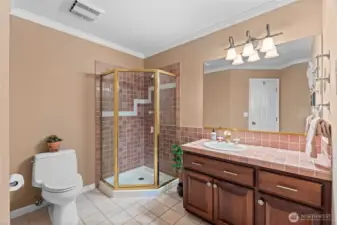 Located on the main floor, this common space bathroom is fitted with it's own glass enclosed shower space.