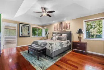 Accented with these beautiful hardwood floors, this primary bedroom balances luxury and comfort perfectly.