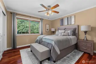 Secondary bedroom with full sliding door closet and shared bathroom.